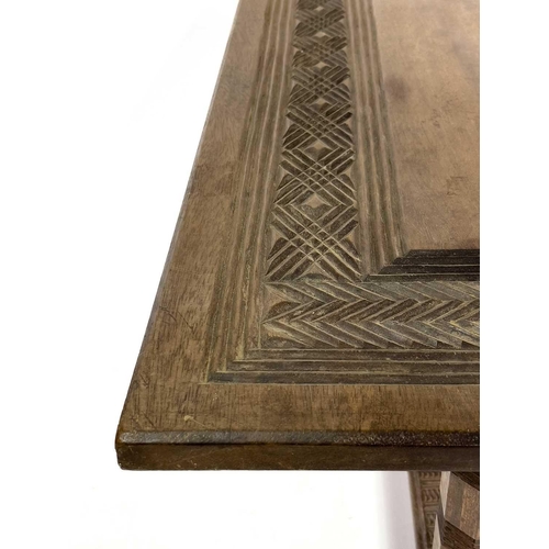 1864 - An African hardwood rectangular coffee table. Probably Nigeria, with carved geometric design to the ... 