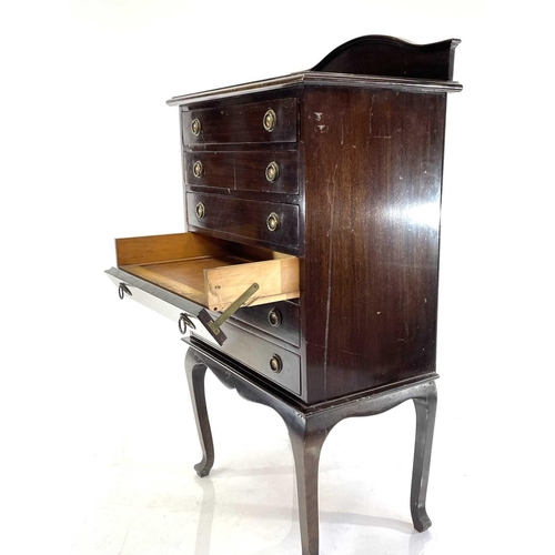 1870 - An Edwardian mahogany music cabinet. Fitted six fall-front drawers on angled cabriole legs, height 1... 