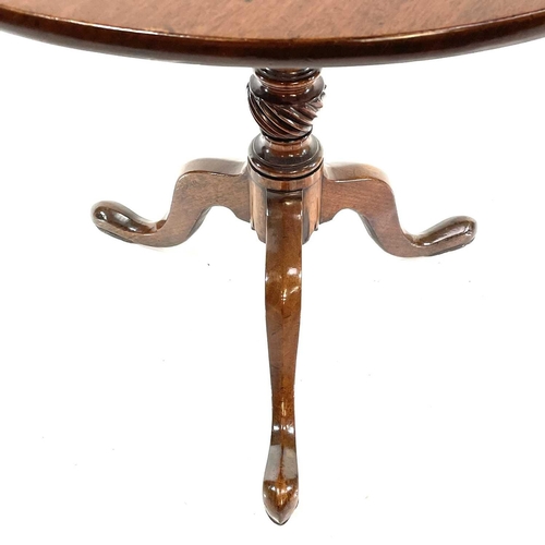 1874 - A George III mahogany tripod table. With a tip-top on a wrythen turned pillar and tripod base, heigh... 