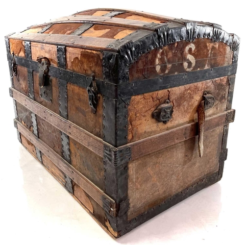 1881 - An oak and metal banded dome top trunk. Circa 1880, labelled for J.C.Sweeney, Newcastle-on-Tyne, hei... 