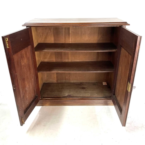 1886 - A Victorian mahogany cupboard. Fitted two arch panel doors enclosing shelves, on a plinth base, heig... 