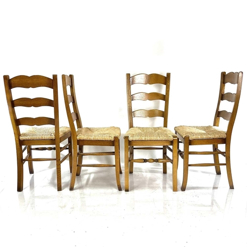 1888 - An oak rectangular dining table and four ladderback chairs. Rectangular, raised on square legs, heig... 