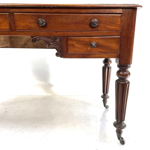 1891 - A William IV mahogany side table. With a raised back and fitted with four drawers on turned and flut... 