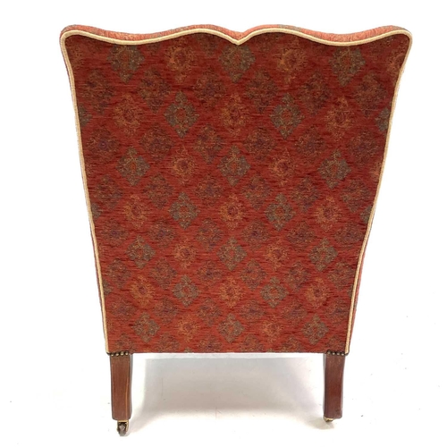 1896 - An Edwardian mahogany framed armchair. With shaped back and arms on square taper legs and castors, o... 