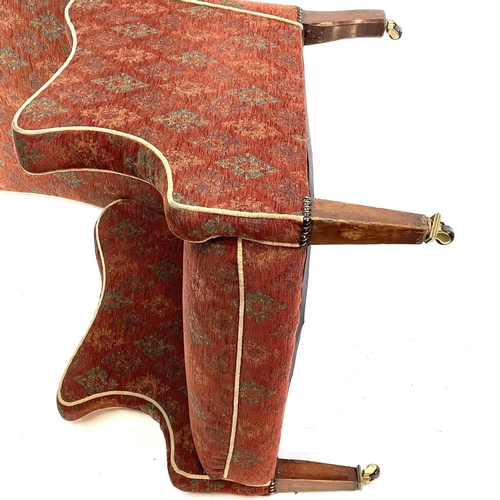 1896 - An Edwardian mahogany framed armchair. With shaped back and arms on square taper legs and castors, o... 