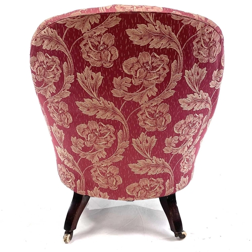 1897 - A mid-Victorian walnut framed button back armchair. With rose brocade upholstery on turned front leg... 