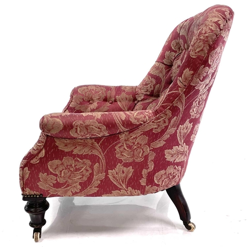 1897 - A mid-Victorian walnut framed button back armchair. With rose brocade upholstery on turned front leg... 