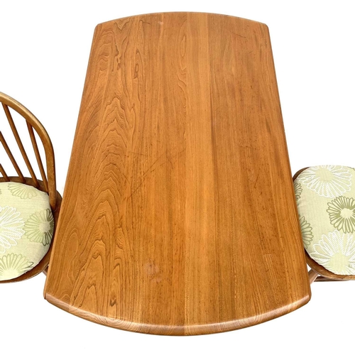 1898 - An Ercol light elm twin flap dining table. On splay square legs, height 72cm, width 112cm, depth 128... 