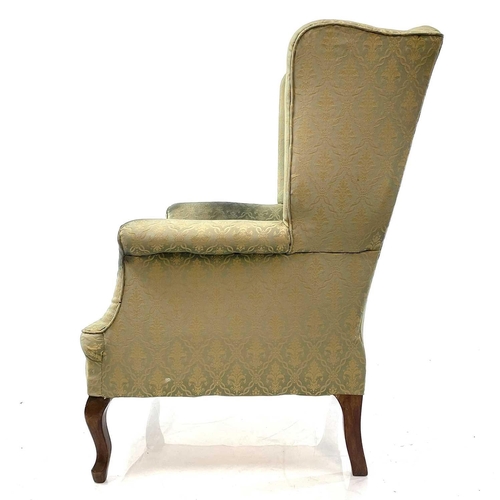 1899 - An Edwardian walnut framed wing armchair. Raised on moulded cabriole front legs, height 106cm, width... 