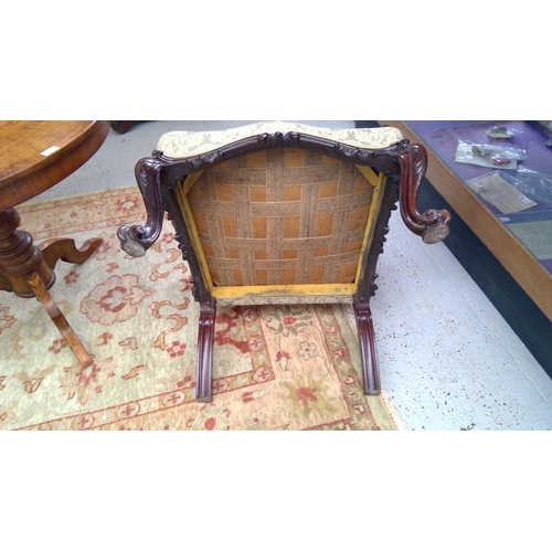 1903 - A George III mahogany Gainsborough type open armchair. The padded arms with prominent moulded outswe... 