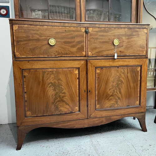 1904 - A George III mahogany and satinwood banded secretaire bookcase. With an arcaded frieze, above two ar... 