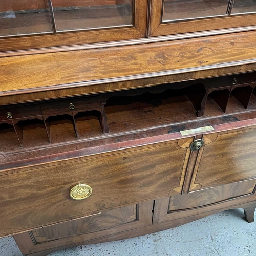 1904 - A George III mahogany and satinwood banded secretaire bookcase. With an arcaded frieze, above two ar... 