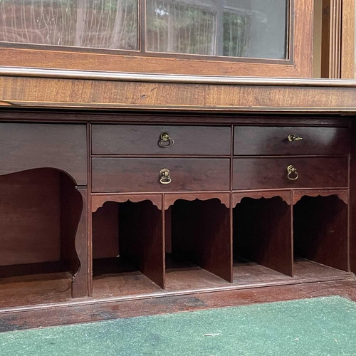 1904 - A George III mahogany and satinwood banded secretaire bookcase. With an arcaded frieze, above two ar... 