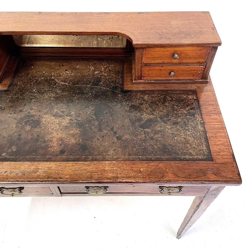 1907 - An early Victorian rosewood and line inlaid writing desk. The shaped superstructure with four drawer... 