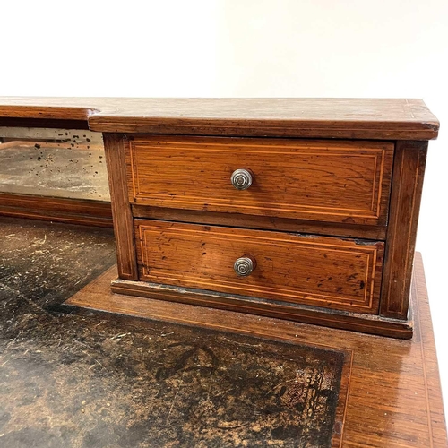 1907 - An early Victorian rosewood and line inlaid writing desk. The shaped superstructure with four drawer... 