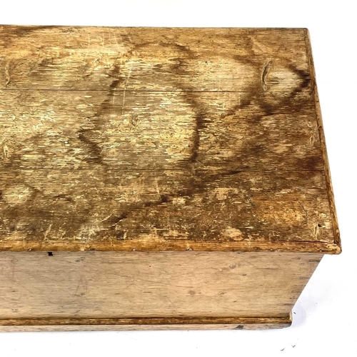 1911 - A Victorian pine trunk. Fitted with a candle box, height 50cm, width 95cm, depth 48cm.