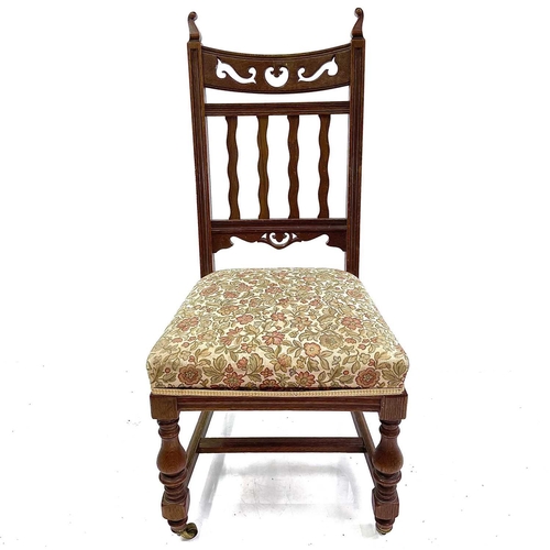 1916 - A set of four Arts and Crafts design oak dining chairs. With wavy slat backs, sprung seats and on ba... 