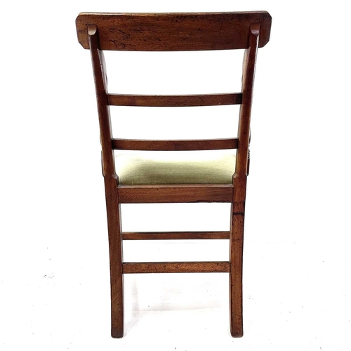 1918 - A Regency mahogany carver chair. With bar back and fluted horizontal slats on square legs.