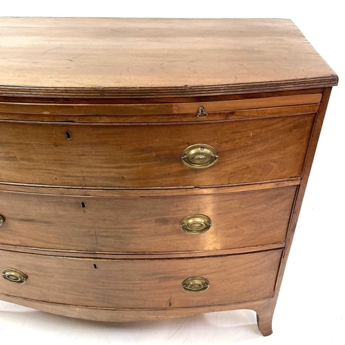 1921 - A 19th century mahogany bow front chest. Fitted a brushing slide above three graduated long drawers ... 