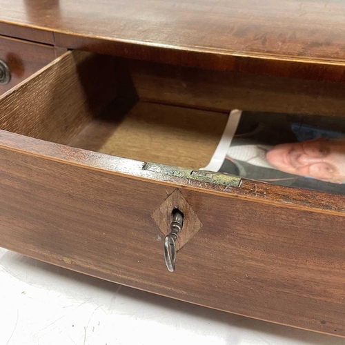 1922 - A late George III mahogany swing toilet mirror. The bow front base fitted three drawers, height 52.5... 