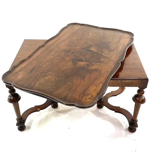 1924 - A walnut coffee table. With removable tray top and raised on turned legs and flattened stretchers, h... 