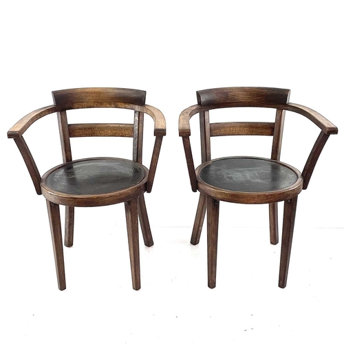 1931 - A pair of continental beech cafe elbow chairs. With circular plywood seats on square legs circa 1910... 