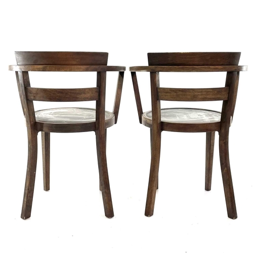 1931 - A pair of continental beech cafe elbow chairs. With circular plywood seats on square legs circa 1910... 