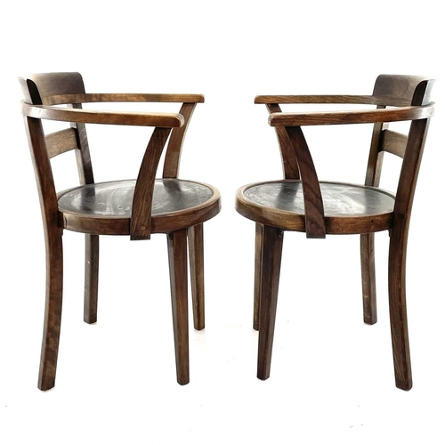 1931 - A pair of continental beech cafe elbow chairs. With circular plywood seats on square legs circa 1910... 