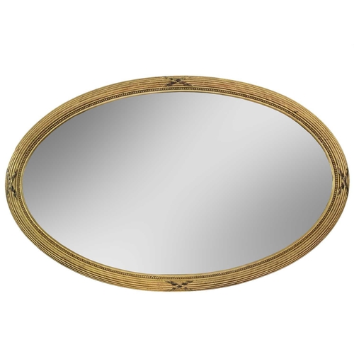 1933 - An early 20th century gilt oval bevelled edge mirror. With reeded and beaded borders, 84cm x 54cm.