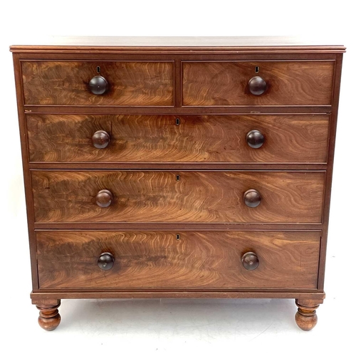 1938 - A 19th century mahogany chest of drawers. With two short and three long drawers on turned bun feet, ... 