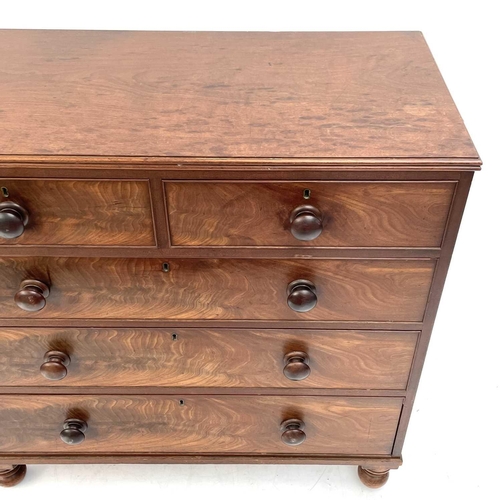 1938 - A 19th century mahogany chest of drawers. With two short and three long drawers on turned bun feet, ... 