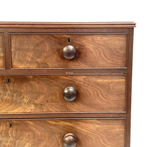 1938 - A 19th century mahogany chest of drawers. With two short and three long drawers on turned bun feet, ... 