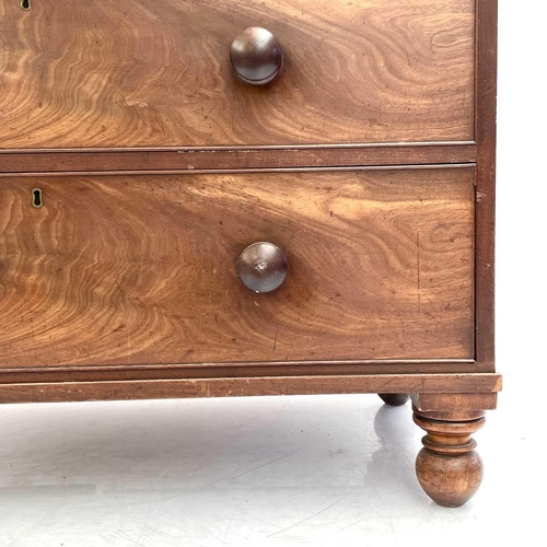 1938 - A 19th century mahogany chest of drawers. With two short and three long drawers on turned bun feet, ... 