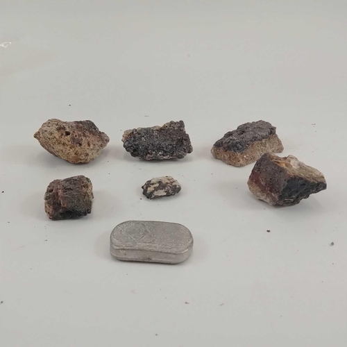 214 - Rare location tin: Six pieces of Cligga mine tin ore. Together with a piece of tin metal from Cligga... 