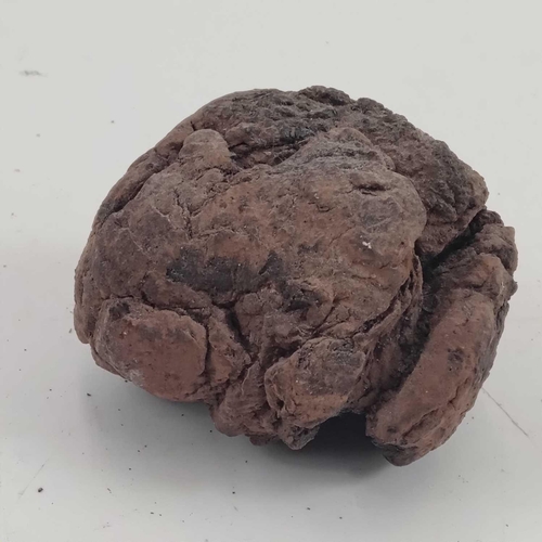 221 - A ball clay lump, used for securing a candle to a miner's helmet. Approximate diameter 6.5cm. Found ... 