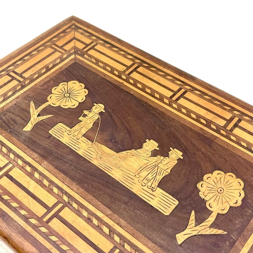 224 - A marquetry box decorated with a naive scene within parquetry borders. Height 11cm width 33.5cm dept... 