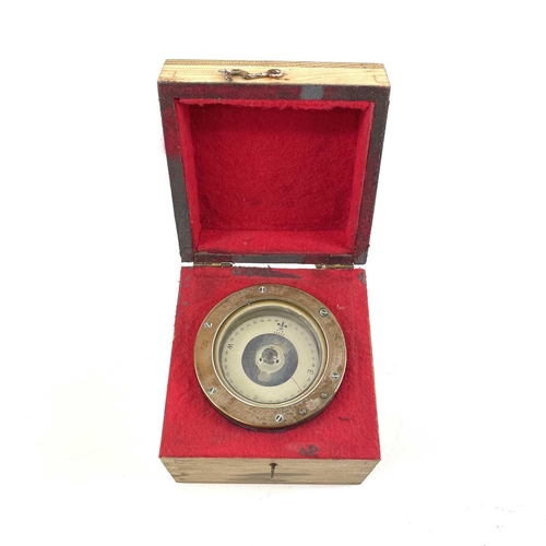 235 - A Sestral compass on a gimbal mount serial number B4/31439L/64. In a fitted box with a slide lid com... 