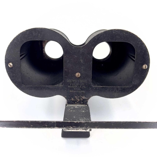 239 - A Keystone View Co metal stereoscope viewer. Together with three other early 20th century stereoscop... 