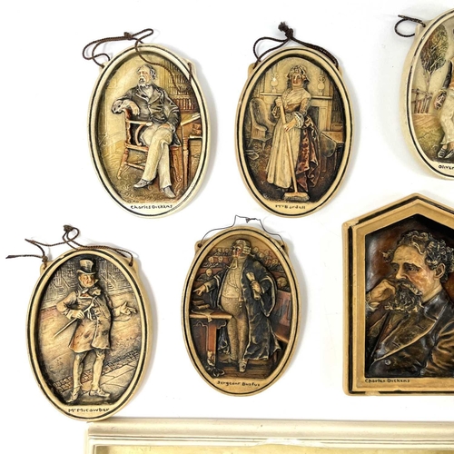 241 - A large collection of Osbourne Ivorex plaques. Mostly oval Dickens characters and a rectangular St M... 