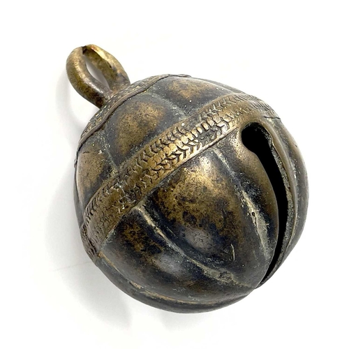 266 - An Indian bronze elephant bell. Diameter 6cm, together with a steel cow bell (2).