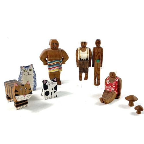 267 - LYN MUIR A collection of wood carved and painted figures amusingly decorated as holidaymakers and an... 