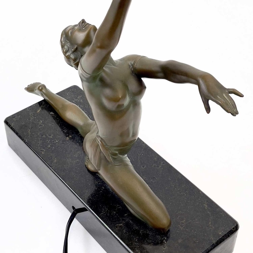 273 - An Art Deco style table lamp. Modelled as a female figure holding an amber glass ball, on a rectangu... 