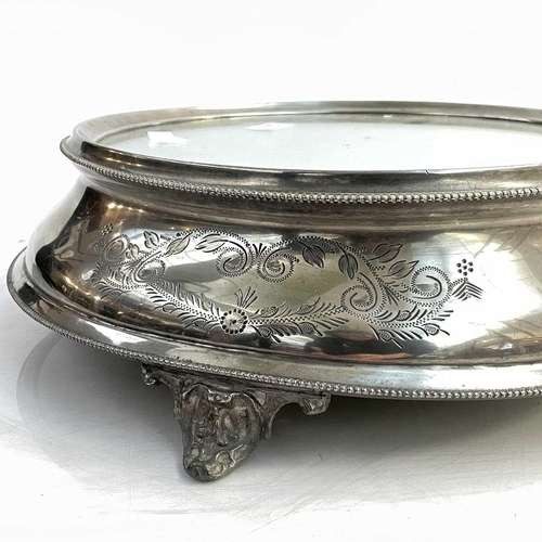 274 - A late Victorian electroplated mirror plateau cake stand of circular form. With engraved decoration ... 