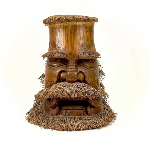 275 - Two oriental carved bamboo root masks of bearded men. Heights 38cm and 35.5cm.