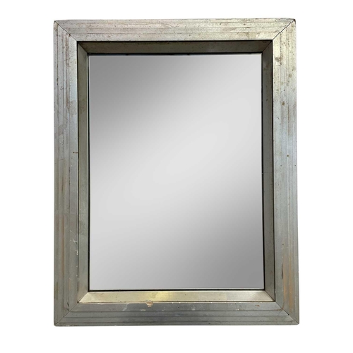 284 - An Art Deco mirror with stepped silvered rectangular frame. Height 50.5cm, width 39.5cm.