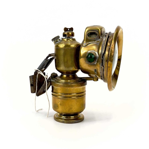 287 - An early 20th century brass bicycle lantern by Panther P&H Birmingham. Height 15cm.