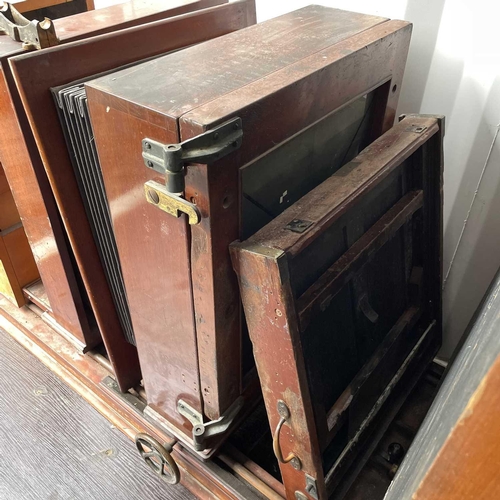 293 - A Hunter & Penrose process camera of large proportions Mahogany cased with brass fittings and on a l... 