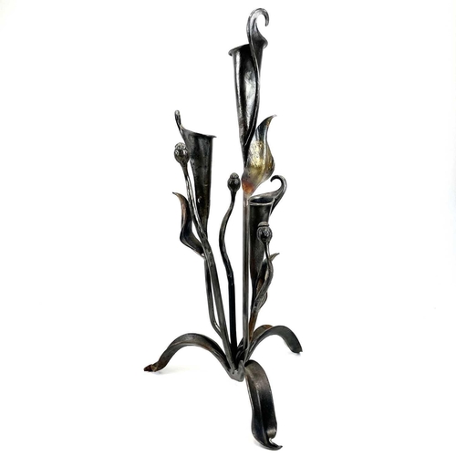 303 - A pair of metalwork triple Lilly candleholders possibly by Roy Thedvall. Height 61cm.