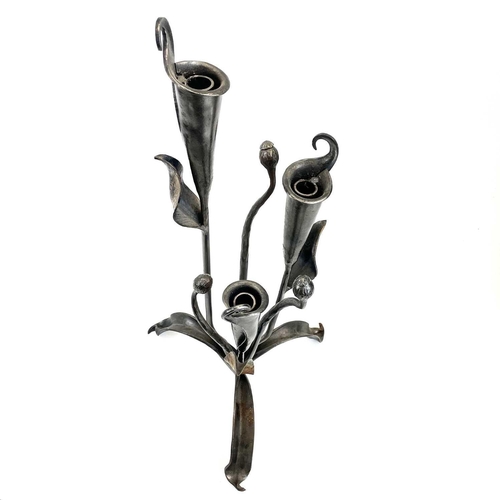 303 - A pair of metalwork triple Lilly candleholders possibly by Roy Thedvall. Height 61cm.