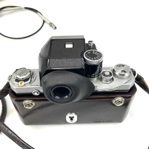 307 - A Nikon F Photomatic FTn serial number 6875184. Fitted with Nikkor-H Auto 1:2 50mm No. 795267 togeth... 